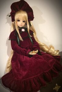Rating: Safe Score: 0 Tags: 1girl blonde_hair blue_eyes bonnet bow doll dress expressionless long_hair long_sleeves looking_at_viewer red_dress shinku sitting solo User: admin