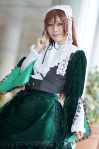 Rating: Safe Score: 0 Tags: 1girl bangs blurry blurry_background brown_hair depth_of_field dress frills green_dress green_eyes heterochromia lips lolita_fashion long_hair long_sleeves looking_at_viewer red_eyes ribbon sitting smile solo suiseiseki User: admin