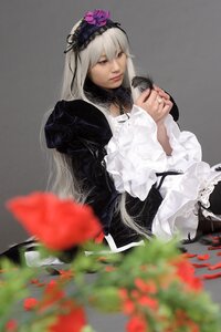 Rating: Safe Score: 0 Tags: 1girl black_dress blurry blurry_foreground depth_of_field dress flower frilled_sleeves frills gothic_lolita grey_background hairband lips lolita_fashion long_hair long_sleeves looking_at_viewer photo sitting solo suigintou very_long_hair User: admin