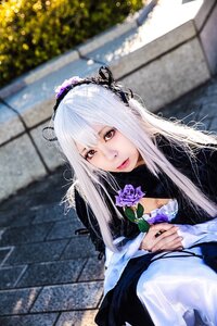 Rating: Safe Score: 0 Tags: 1girl blurry blurry_background closed_mouth depth_of_field dress fence flower hairband holding holding_flower lips long_hair long_sleeves looking_at_viewer purple_flower purple_rose red_eyes ribbon rose silver_hair solo suigintou upper_body User: admin