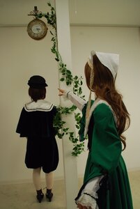 Rating: Safe Score: 0 Tags: 2girls brown_hair dress flower green_dress hat indoors long_hair long_sleeves multiple_cosplay multiple_girls plant standing tagme User: admin