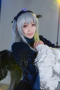 Rating: Safe Score: 0 Tags: 1girl black_wings dress feathered_wings feathers flower frills gothic_lolita hairband lips lolita_fashion long_hair long_sleeves looking_at_viewer pink_eyes realistic silver_hair smile solo suigintou wings User: admin