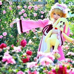 Rating: Safe Score: 0 Tags: 1girl blonde_hair blurry blurry_foreground depth_of_field dress flower hat hinaichigo long_sleeves mob_cap motion_blur photo pink_flower pokemon_(creature) sitting smile solo User: admin