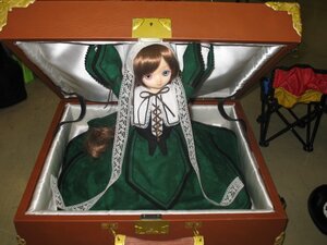 Rating: Safe Score: 0 Tags: 1girl brown_hair doll dress from_above green_dress looking_at_viewer ribbon short_hair sitting solo suiseiseki User: admin