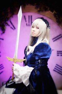 Rating: Safe Score: 0 Tags: 1girl blurry depth_of_field dress frills hairband holding lips long_hair long_sleeves solo suigintou sword weapon User: admin