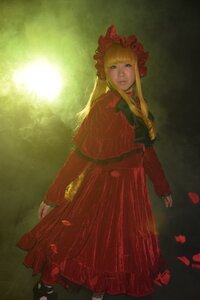 Rating: Safe Score: 0 Tags: 1girl blonde_hair blue_eyes bonnet bow capelet dress flower long_hair long_sleeves looking_at_viewer red_dress rose shinku solo standing User: admin