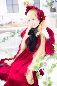 Rating: Safe Score: 0 Tags: 1girl blonde_hair blue_eyes blurry blurry_background blurry_foreground bonnet depth_of_field dress flower long_hair photo red_dress rose shinku solo User: admin