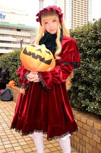 Rating: Safe Score: 0 Tags: 1girl blonde_hair blue_eyes bonnet bow chain-link_fence dress fence frills jack-o'-lantern lolita_fashion long_hair long_sleeves looking_at_viewer outdoors pavement pumpkin red_dress shinku solo standing white_legwear User: admin