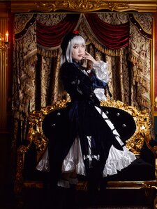 Rating: Safe Score: 0 Tags: 1girl black_dress curtains dress frame frills full_body hat indoors lips lolita_fashion long_sleeves looking_at_viewer red_eyes sitting solo suigintou User: admin