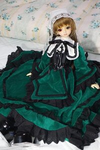 Rating: Safe Score: 0 Tags: 1girl bangs blonde_hair brown_hair doll dress frills green_dress lolita_fashion long_hair long_sleeves looking_at_viewer ribbon sitting solo suiseiseki User: admin