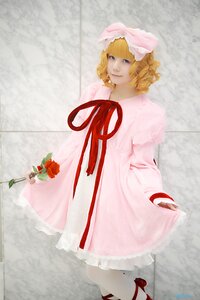 Rating: Safe Score: 0 Tags: 1girl blonde_hair blue_eyes curly_hair dress flower frills hat hinaichigo holding_flower lips looking_at_viewer pink_dress red_flower ribbon rose shoes short_hair smile solo User: admin