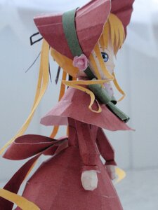 Rating: Safe Score: 0 Tags: 1girl blonde_hair blue_eyes bow doll dress flower hat long_hair long_sleeves looking_at_viewer looking_back profile red_dress rose shinku solo User: admin