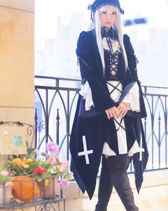 Rating: Safe Score: 0 Tags: 1girl blurry blurry_background blurry_foreground boots depth_of_field flower full_body long_hair long_sleeves looking_at_viewer ribbon solo standing suigintou User: admin