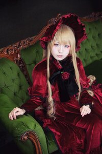 Rating: Safe Score: 0 Tags: 1girl blonde_hair blue_eyes bonnet dress flower lips long_hair long_sleeves looking_at_viewer red_dress rose shinku sitting solo User: admin