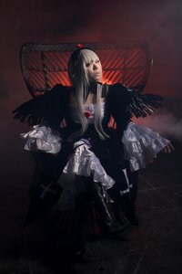 Rating: Safe Score: 0 Tags: 1girl black_eyes black_hair black_wings cross dress feathered_wings long_hair sitting solo suigintou wings User: admin