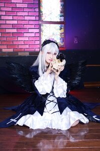 Rating: Safe Score: 0 Tags: 1girl bangs dress holding long_hair long_sleeves looking_at_viewer purple_eyes silver_hair sitting solo suigintou white_dress User: admin