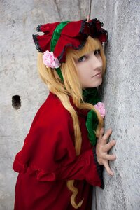 Rating: Safe Score: 0 Tags: 1girl blonde_hair blue_eyes bonnet bow dress flower lips long_hair long_sleeves looking_at_viewer lying on_stomach photo realistic red_dress rose shinku solo User: admin