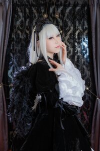 Rating: Safe Score: 0 Tags: 1girl black_dress closed_mouth dress frills gothic_lolita hairband lips lolita_fashion long_hair long_sleeves looking_at_viewer red_eyes solo suigintou User: admin