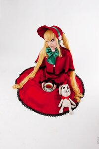 Rating: Safe Score: 0 Tags: 1girl blonde_hair blue_eyes bonnet bow capelet cup dress green_bow long_hair red_dress saucer shinku sitting solo tea teacup User: admin