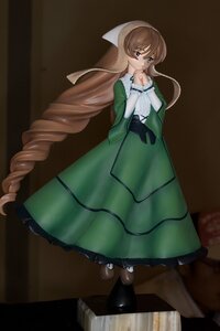 Rating: Safe Score: 0 Tags: 1girl brown_hair doll dress drill_hair frills gloves green_dress green_eyes long_hair long_sleeves solo suiseiseki very_long_hair User: admin