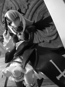 Rating: Safe Score: 0 Tags: 1girl cross doll dress frills greyscale holding long_hair long_sleeves looking_at_viewer monochrome ribbon rose solo standing suigintou very_long_hair wings User: admin