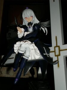 Rating: Safe Score: 0 Tags: 1girl black_wings boots crossed_legs doll dress feathers frills hairband knee_boots long_hair long_sleeves looking_at_viewer red_eyes silver_hair sitting solo suigintou wings User: admin