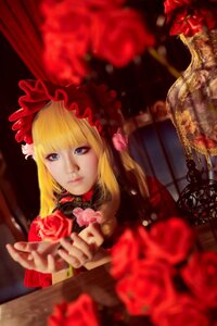 Rating: Safe Score: 0 Tags: 1girl bangs blonde_hair blue_eyes blurry blurry_background blurry_foreground curtains depth_of_field dress flower lips long_hair looking_at_viewer red_flower red_rose rose shinku solo User: admin