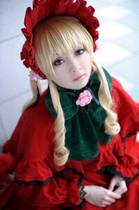 Rating: Safe Score: 0 Tags: 1girl blonde_hair blue_eyes blurry blurry_background blurry_foreground bonnet bow depth_of_field dress flower lips long_hair long_sleeves looking_at_viewer photo pink_flower pink_rose red_capelet red_dress rose shinku sidelocks solo User: admin