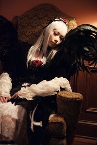 Rating: Safe Score: 0 Tags: 1girl bangs black_dress closed_mouth dress feathers flower fur_trim gothic_lolita hairband lips long_hair long_sleeves rose sitting solo suigintou white_hair User: admin