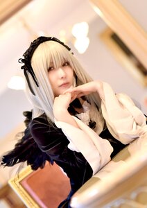 Rating: Safe Score: 0 Tags: 1girl 3d black_dress black_ribbon blurry blurry_background chair closed_mouth depth_of_field dress hairband long_hair long_sleeves looking_at_viewer realistic silver_hair sitting solo suigintou wings User: admin