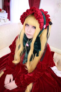 Rating: Safe Score: 0 Tags: 1girl bangs blonde_hair blue_eyes blurry blurry_background bonnet curtains depth_of_field dress flower indoors lips long_hair long_sleeves looking_at_viewer own_hands_together photo red_dress shinku sitting solo User: admin