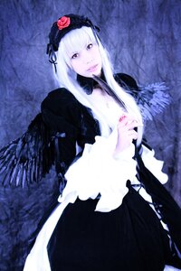 Rating: Safe Score: 0 Tags: 1girl black_dress black_wings dress flower frilled_sleeves frills hairband lips long_hair long_sleeves looking_at_viewer pale_skin silver_hair solo suigintou wings User: admin
