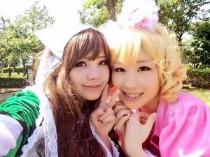 Rating: Safe Score: 0 Tags: 2girls blonde_hair brown_eyes brown_hair day holding_hands looking_at_viewer multiple_cosplay multiple_girls nail_polish outdoors pink_nails smile sunlight tagme tree yuri User: admin