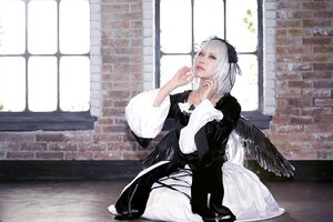 Rating: Safe Score: 0 Tags: 1girl architecture building closed_mouth dress feathered_wings feathers gothic_lolita hairband indoors lolita_fashion long_sleeves silver_hair sitting solo suigintou window wings User: admin