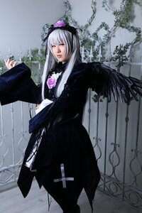 Rating: Safe Score: 0 Tags: 1girl black_dress black_wings dress flower lips long_hair long_sleeves looking_at_viewer silver_hair solo standing suigintou wings User: admin