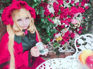Rating: Safe Score: 0 Tags: 1girl bangs blonde_hair blue_eyes bow cup dress flower hat long_hair looking_at_viewer pink_flower pink_rose red_flower red_rose rose shinku sitting solo teacup traditional_media User: admin