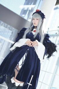 Rating: Safe Score: 0 Tags: 1girl bangs blurry blurry_background depth_of_field dress frills long_hair long_sleeves looking_at_viewer solo standing suigintou User: admin