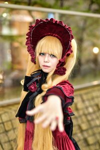 Rating: Safe Score: 0 Tags: 1girl blonde_hair blue_eyes blurry blurry_background blurry_foreground bonnet depth_of_field dress drill_hair flower long_hair looking_at_viewer photo red_flower rose shinku solo User: admin