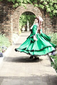 Rating: Safe Score: 0 Tags: 1girl brick_wall brown_hair dress flower frills green_dress long_sleeves outdoors pantyhose pavement solo standing suiseiseki User: admin