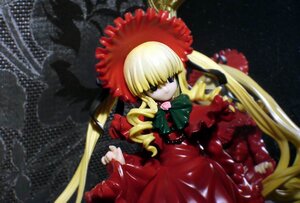 Rating: Safe Score: 0 Tags: 1girl blonde_hair bonnet bow bowtie doll dress drill_hair long_hair long_sleeves red_dress shinku solo twintails very_long_hair User: admin