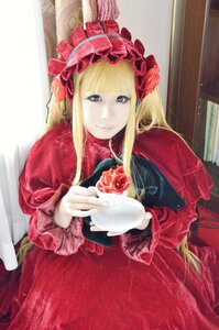 Rating: Safe Score: 0 Tags: 1girl bangs blonde_hair blue_eyes curtains dress flower long_hair long_sleeves looking_at_viewer pink_rose red_dress red_flower red_rose rose shinku sitting smile solo User: admin