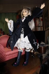 Rating: Safe Score: 0 Tags: 1girl boots doll dress frills indoors lolita_fashion long_sleeves outstretched_arm solo standing suigintou User: admin