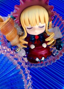 Rating: Safe Score: 0 Tags: 1girl bangs blonde_hair bonnet chibi closed_eyes cup doll dress drill_hair hat long_hair shinku sleeping solo striped striped_background User: admin