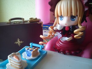 Rating: Safe Score: 0 Tags: 1girl blonde_hair blue_eyes bonnet bow cup doll dress drill_hair figure flower hat long_hair pink_rose red_dress red_rose rose shinku sitting solo User: admin