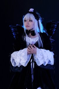 Rating: Safe Score: 0 Tags: 1girl black_background black_dress closed_mouth dress feathers flower frills gothic_lolita hands_together long_hair long_sleeves solo standing suigintou wide_sleeves wings User: admin
