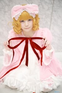 Rating: Safe Score: 0 Tags: 1girl bangs blonde_hair blue_eyes blurry bow curly_hair depth_of_field dress frills hina_ichigo hinaichigo long_sleeves looking_at_viewer pink_bow pink_dress ribbon short_hair sitting smile solo User: admin