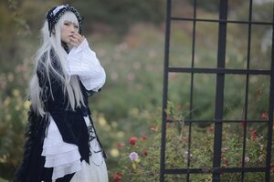 Rating: Safe Score: 0 Tags: 1girl bangs black_dress blurry blurry_background depth_of_field dress flower hairband long_hair long_sleeves solo standing suigintou very_long_hair white_hair User: admin