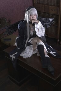 Rating: Safe Score: 0 Tags: 1girl black_wings boots doll_joints dress feathered_wings feathers frills gothic_lolita indoors kneehighs long_hair ribbon sitting solo suigintou white_hair wings User: admin