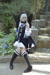 Rating: Safe Score: 0 Tags: 1girl black_legwear dress flower frills gothic_lolita lolita_fashion long_hair outdoors solo standing suigintou thighhighs User: admin