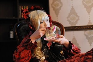 Rating: Safe Score: 0 Tags: 1girl blonde_hair blurry bonnet depth_of_field dress food frilled_sleeves frills indoors long_hair long_sleeves photo shinku solo table teacup User: admin